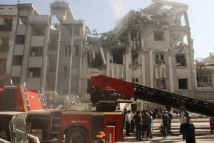 Iran attack on Israel with missiles targeting Tel Aviv skyline during night airstrike, intercepted by Israeli defense systems