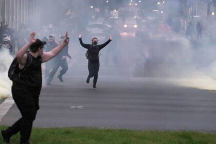 Riot at Portland ICE facility with protesters clashing with federal officers amid tear gas and smoke, June 2025.